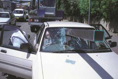 Load Restraint Guide - vehicle impaled by steel beam through front widscreen. driver is being helped by a paramedic