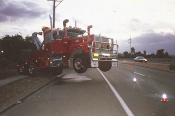 A prime mover with the steer axle lifted due to the weight behind the vehicle
