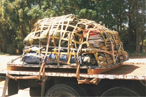 A difficult bulk load restrained by a webbing net on a truck