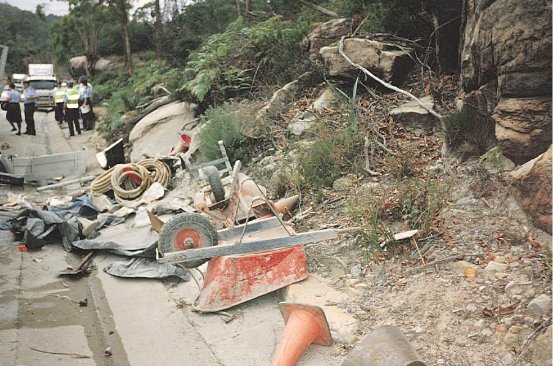 Builders tools are thrown out from a truck on to the side of the road