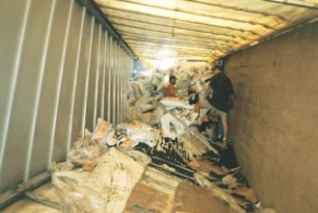 A trailer with small bulk loads thrown around after a rollover