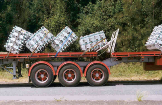 Side view of trailers with aluminium ingots tipped