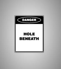 Example of the type of danger sign to be affixed to the hole cover