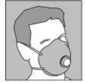Person wearing disposable, half-face particulate respirator.