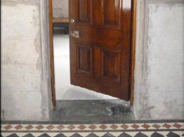 detail of door threshold and ceramic tile border 