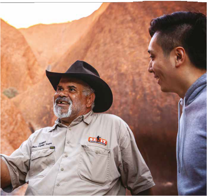 Chapter heading featuring a photograph of a tour guide conversing with a guest