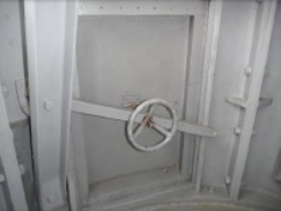 Photograph showing closed lantern room door. Small hand wheel fitted to inside of door. 