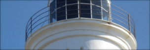 Photograph showing curved balcony wrapped around lighthouse.