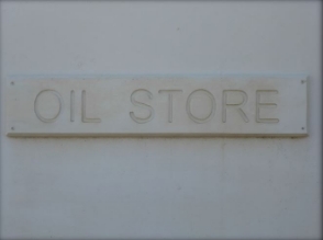 Photograph of a sign that reads Oil Store.