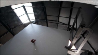 Photograph of square steel platform taken from above. Platform is fitted with steel stanchions and rail pipe.