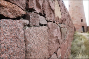 Photograph of granite windbreak wall.