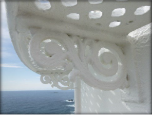 Photograph showing ornate bracket supporting external catwalk fitted to lantern house.