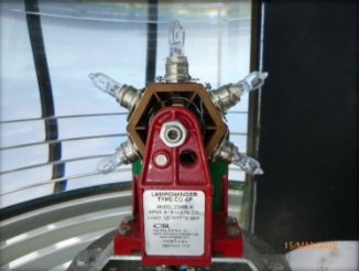 Photograph showing lampchanger sitting inside prismatic lens.