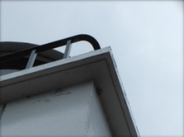 Photograph showing underside of small lighthouse balcony.
