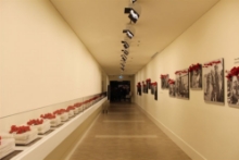 Exit corridor with As of Today artwork on display.