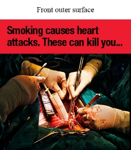 Front outer surface image shows a photo of open heart surgery for heart disease. The patient’s chest cavity is open and there are 2 sets of gloved hands using medical equipment.

Text says Smoking causes heart attacks. 
These can kill you…
