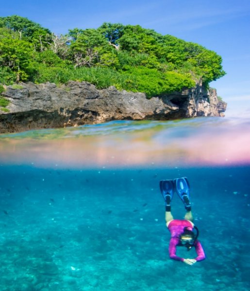 snorkeller in the ocean in front of Christmas Island