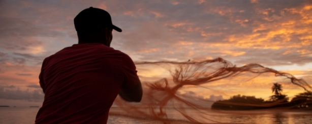 Fisherman throwing a net