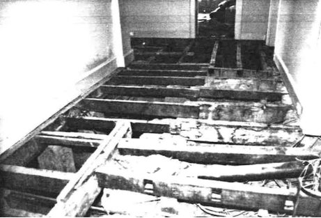 A black and white picture of Kirribilli House floorboards in rows panelling across the floor. 