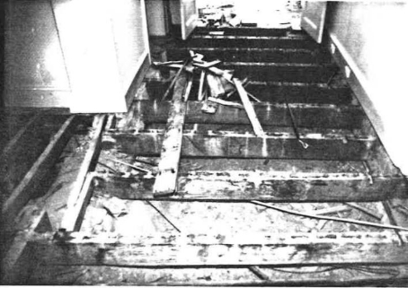 A black and white picture of Kirribilli House floorboards in rows panelling across the floor.