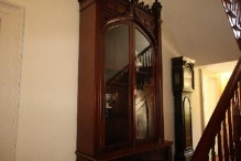 A picture of a dark wood stained cabinet within Kirribilli House