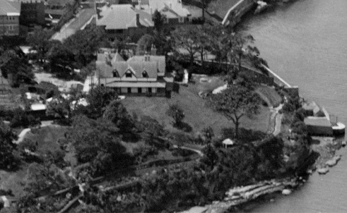 A black and white aerial shot image of Kirribilli House showing its grounds and boat harbour