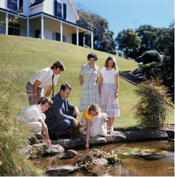 A picture of former Prime Minister Malcolm Fraser, his 4 kids and partner around the fish pond at Kirribilli House